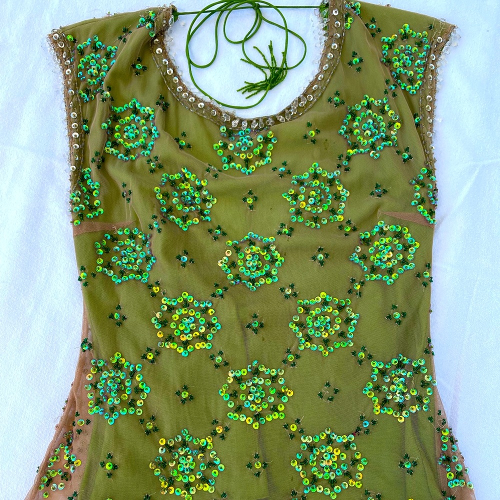 Exquisite hand sewn top with sequins in a beautiful green color